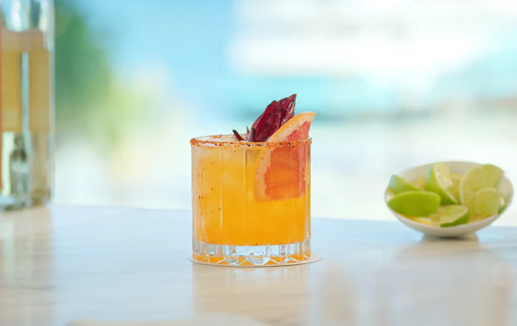 Barracuda Beach Bar at Secrets The Vine Cancun featuring a relaxed beachfront setting with tropical cocktails, beers, and ocean views.