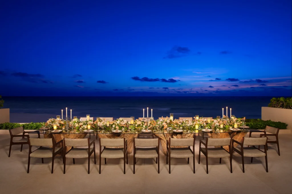Gazebo Terrace oceanfront reception setup with long banquet table at Secrets The Vine Cancun