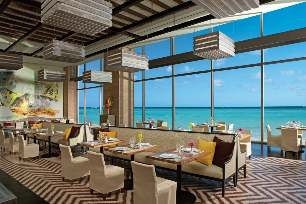 Market Café at Secrets The Vine Cancun featuring a vibrant restaurant setting with international buffet stations and authentic Mexican cuisine.