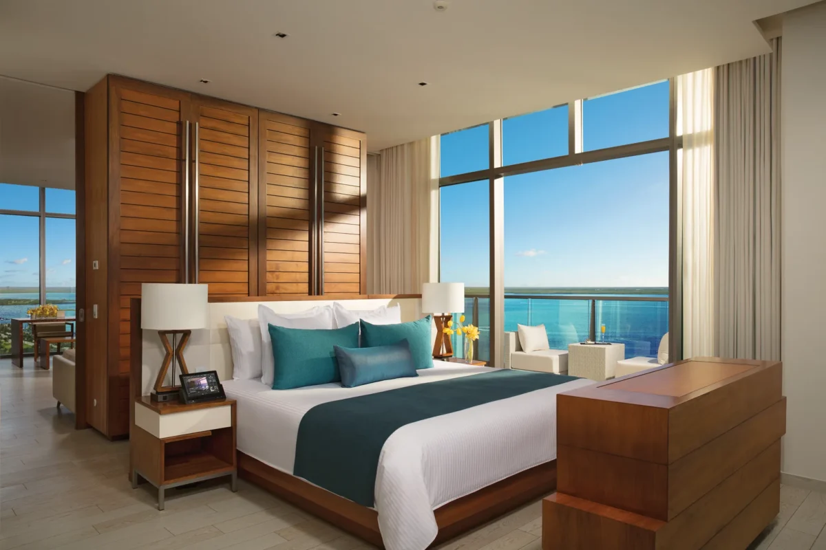 Master Suite Ocean View with king bed and floor-to-ceiling windows at Secrets The Vine Cancun.