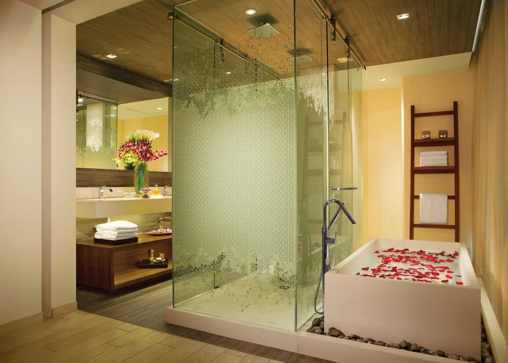 Preferred Club Master Suite Ocean View bathroom with soaking tub, glass shower, and modern vanity at Secrets The Vine Cancun.