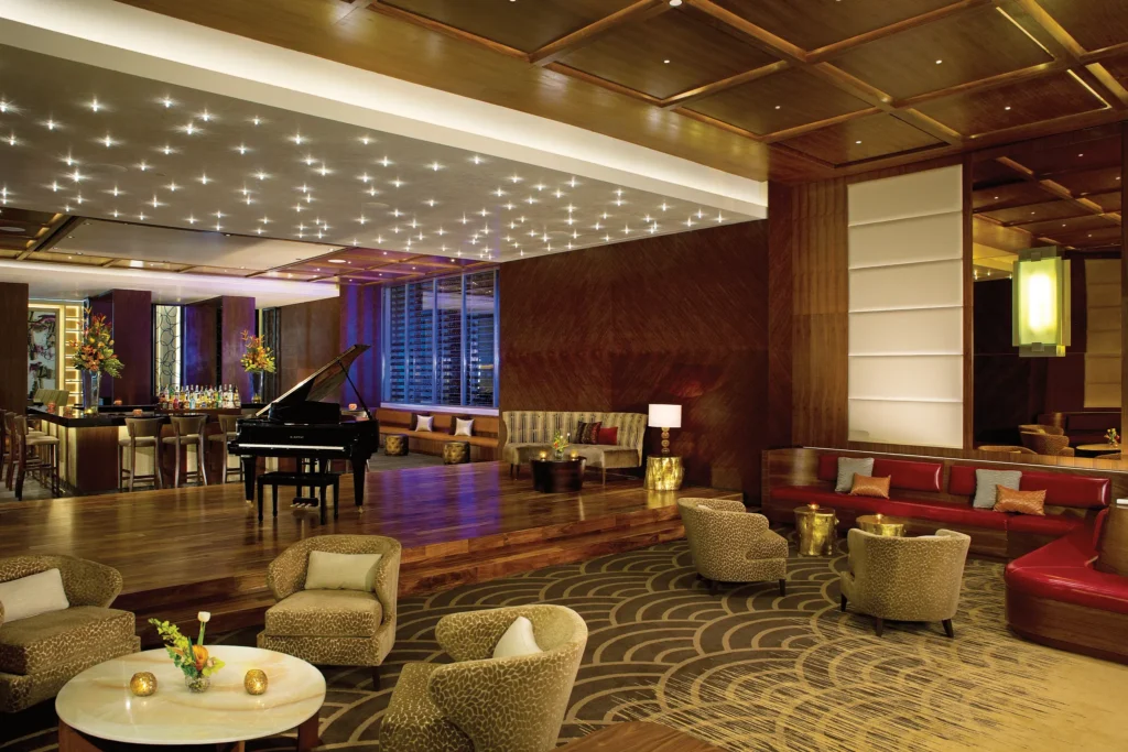 Red Vine Piano Lounge at Secrets The Vine Cancun featuring an elegant piano bar with intimate lighting, live music, and a romantic lounge atmosphere.