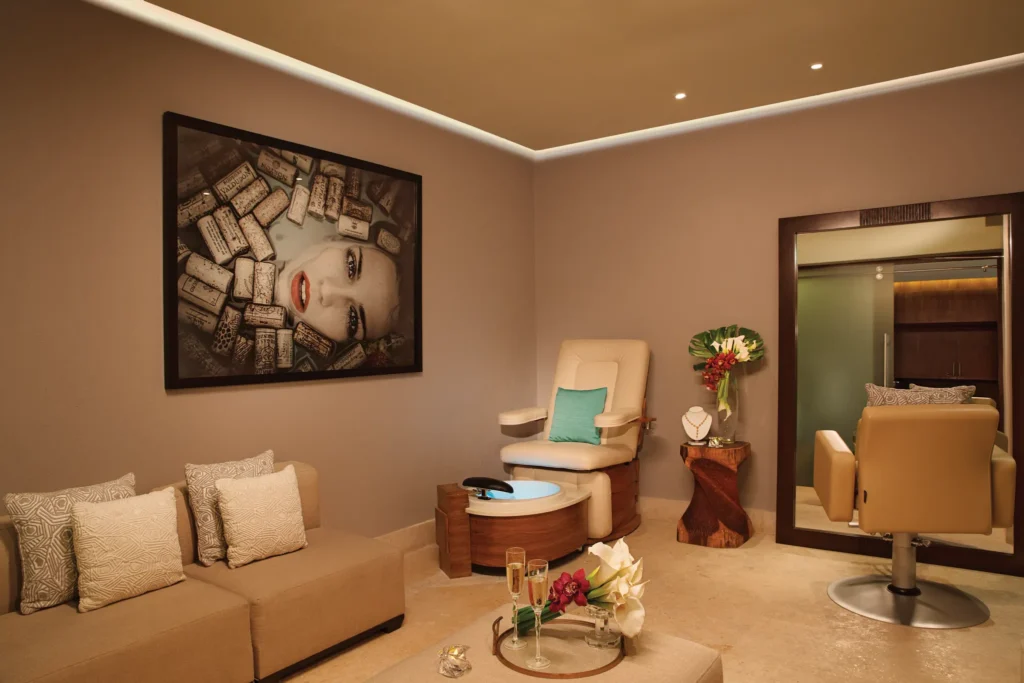Spa bridal suite with vanity mirror, flowers, and relaxation chair at Secrets The Vine Cancun.