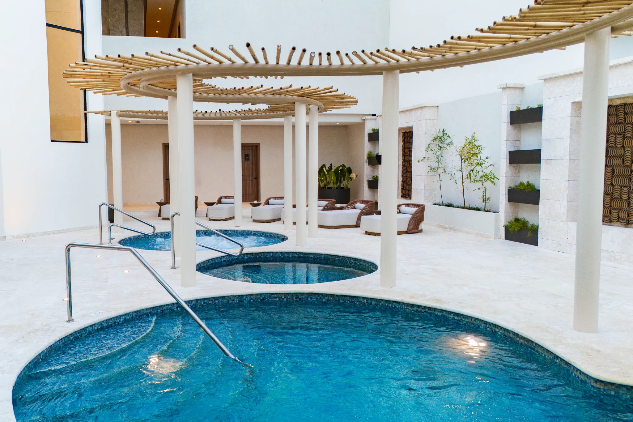Hydrotherapy pools at the spa in Secrets Tides Punta Cana with tranquil soaking tubs and modern relaxation spaces.