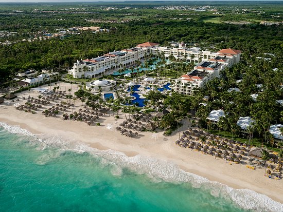 Iberostar Grand Bávaro adults-only all-inclusive resort with colonial architecture, lush gardens, and pristine beach in Punta Cana, Dominican Republic.
