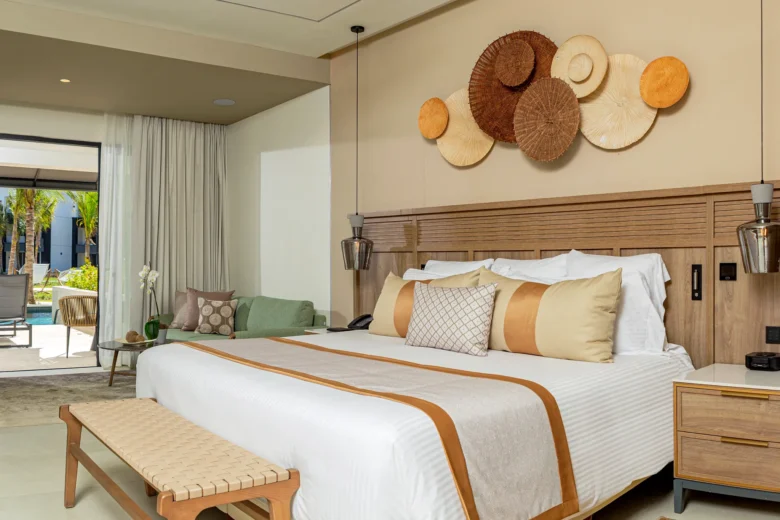 Junior Suite Swim-Out with king bed and private terrace leading to swim-up pool at Secrets Tides Punta Cana.