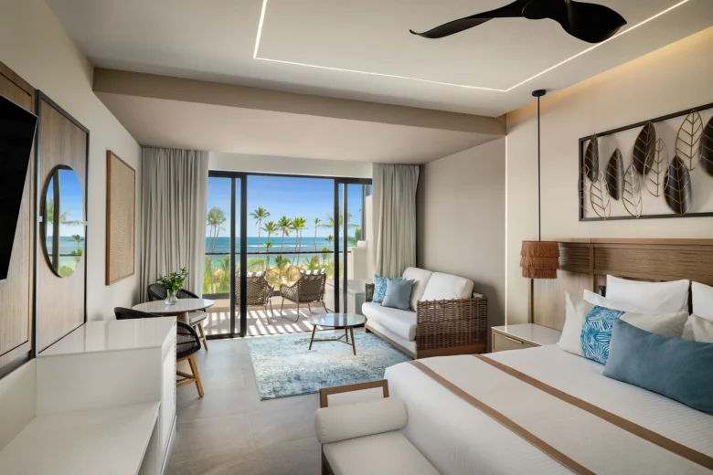 Preferred Club Junior Suite Ocean Front terrace with seating and panoramic ocean view at Secrets Tides Punta Cana.