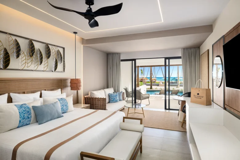 Preferred Club Junior Suite Ocean Front Swim Out with king bed, private terrace, and direct pool access at Secrets Tides Punta Cana.