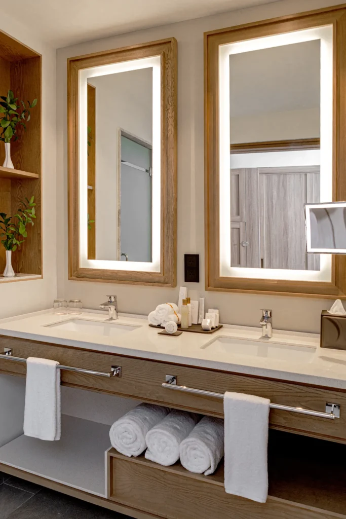 Preferred Club Junior Suite Partial Ocean bathroom with double vanity and illuminated mirrors at Secrets Tides Punta Cana.