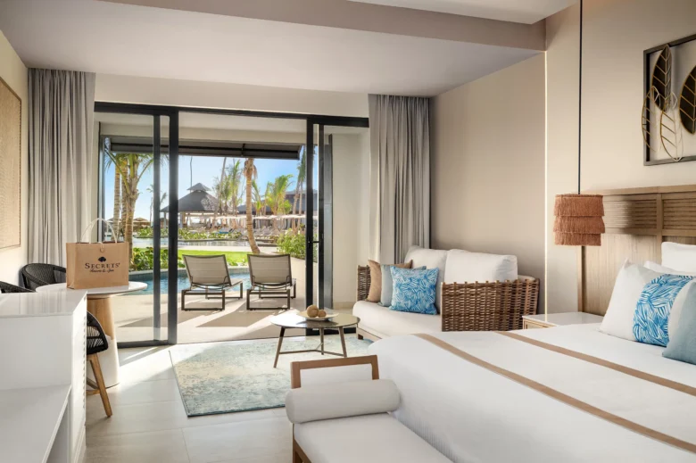 Preferred Club Junior Suite Swim Out terrace with pool access and lounge chairs at Secrets Tides Punta Cana.