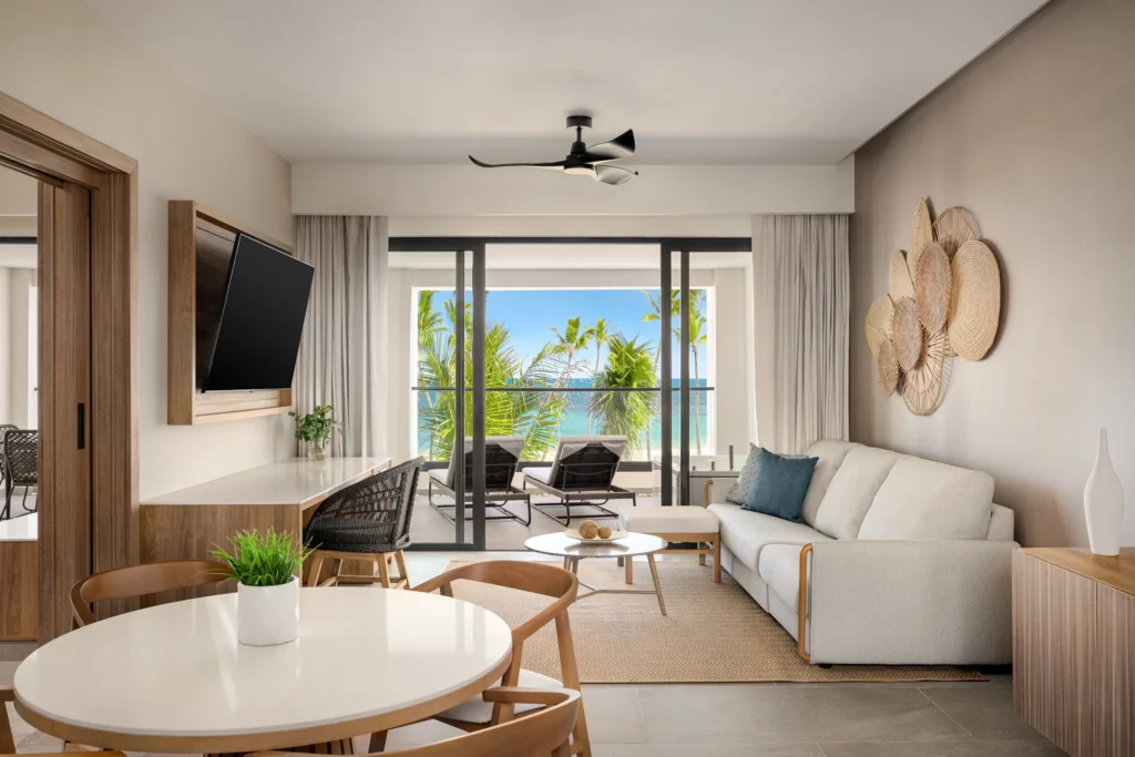Preferred Club Master Suite Ocean Front living room with ocean view terrace at Secrets Tides Punta Cana.