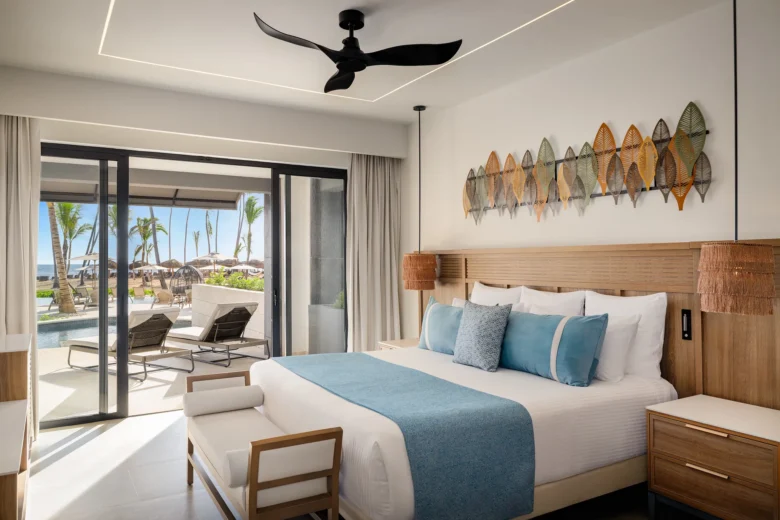 Preferred Club Master Suite Ocean Front Swim Out bedroom with king bed and direct terrace pool access at Secrets Tides Punta Cana.