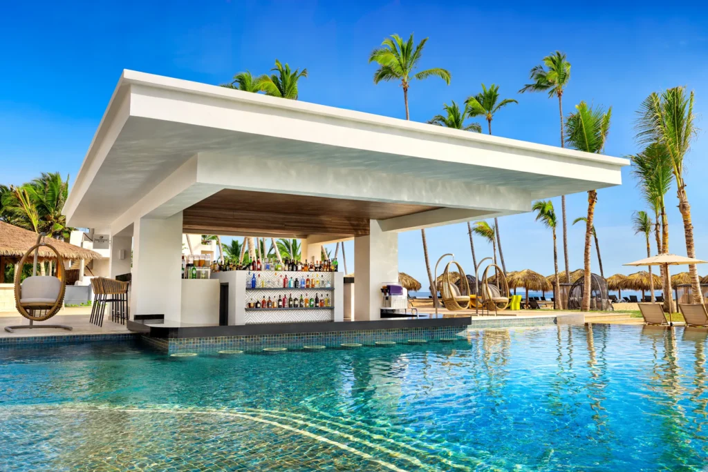 Preferred Club Pool Bar at Secrets Tides Punta Cana featuring a swim-up bar in an exclusive infinity pool with tropical cocktails.