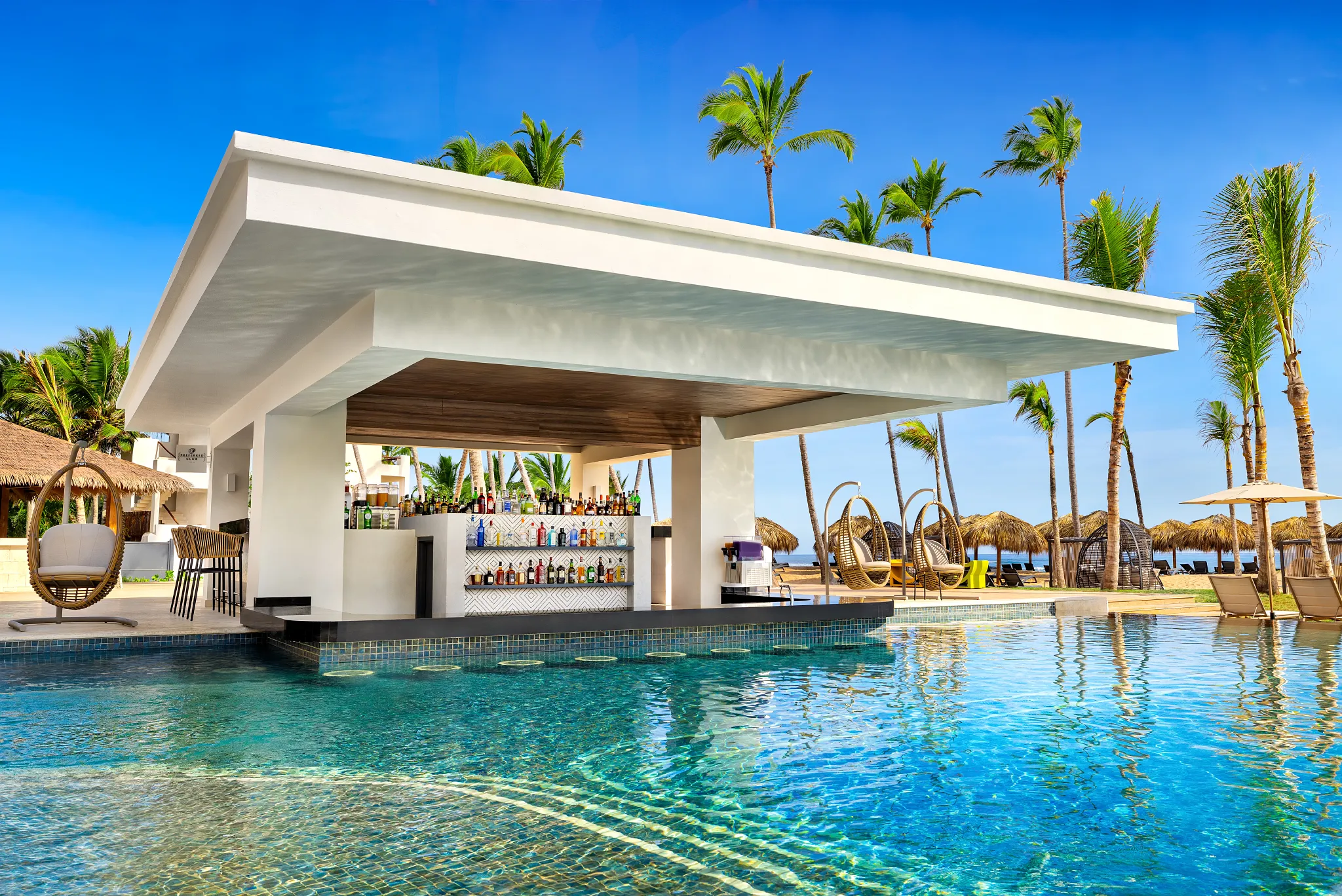 Preferred Club Pool Bar at Secrets Tides Punta Cana offering poolside drinks in an exclusive setting for Preferred Club guests