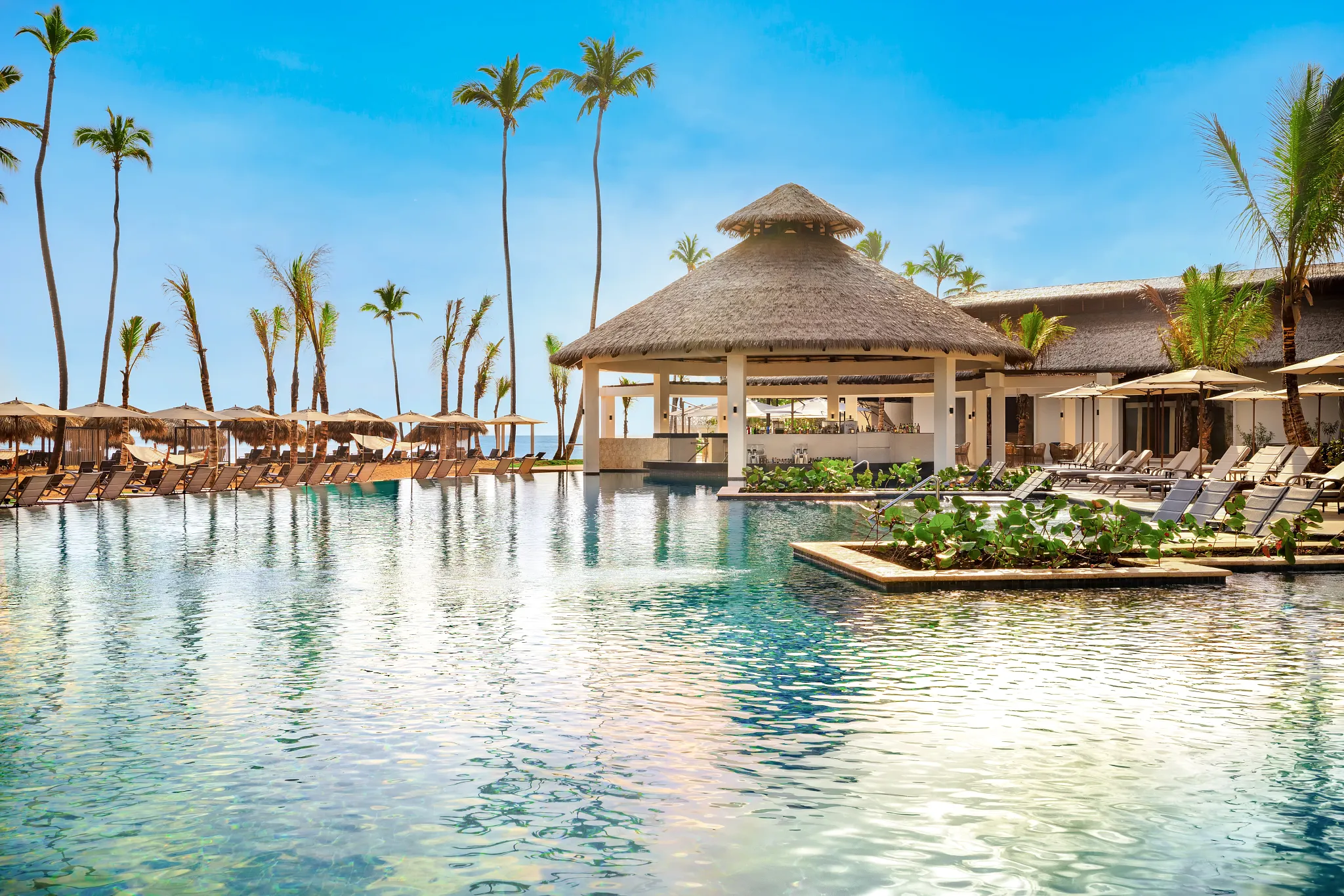Sugar Reef pool bar at Secrets Tides Punta Cana serving tropical cocktails by the main pool