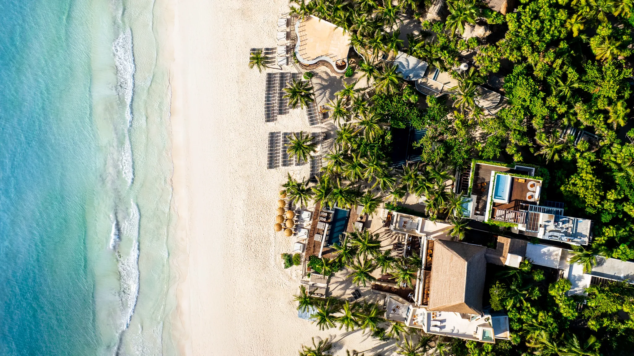Aerial view of Casa Zamna Beach Club and the surrounding white-sand beach along the Caribbean Sea.