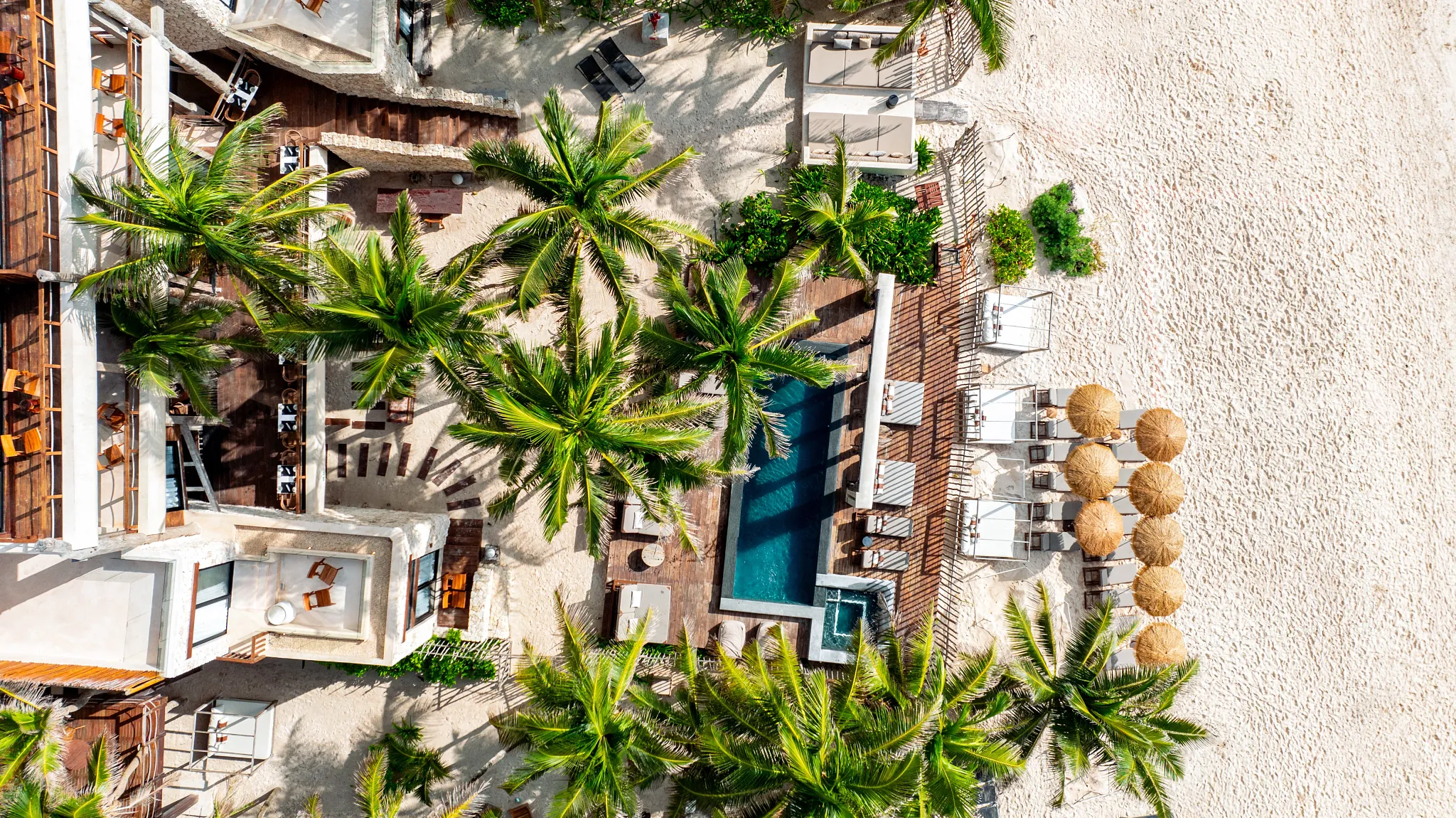 Aerial view of Casa Zamna Beach Club along Tulum's white-sand beach and Caribbean coastline.