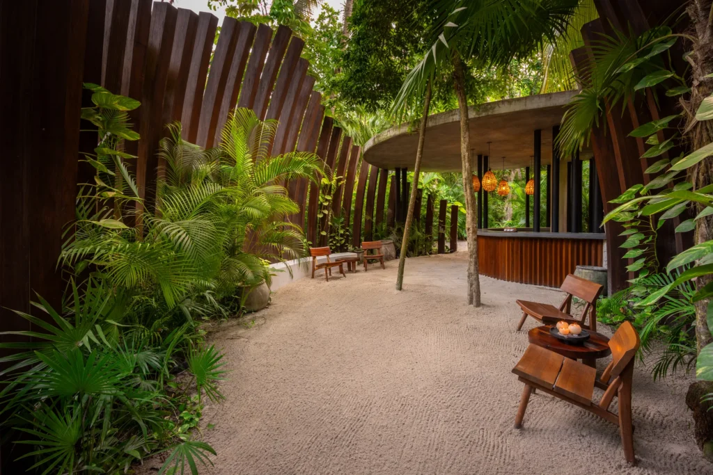 Open-air lobby surrounded by tropical gardens at Casa Zamna Beach Club at Secrets Tulum Resort & Beach Club.
