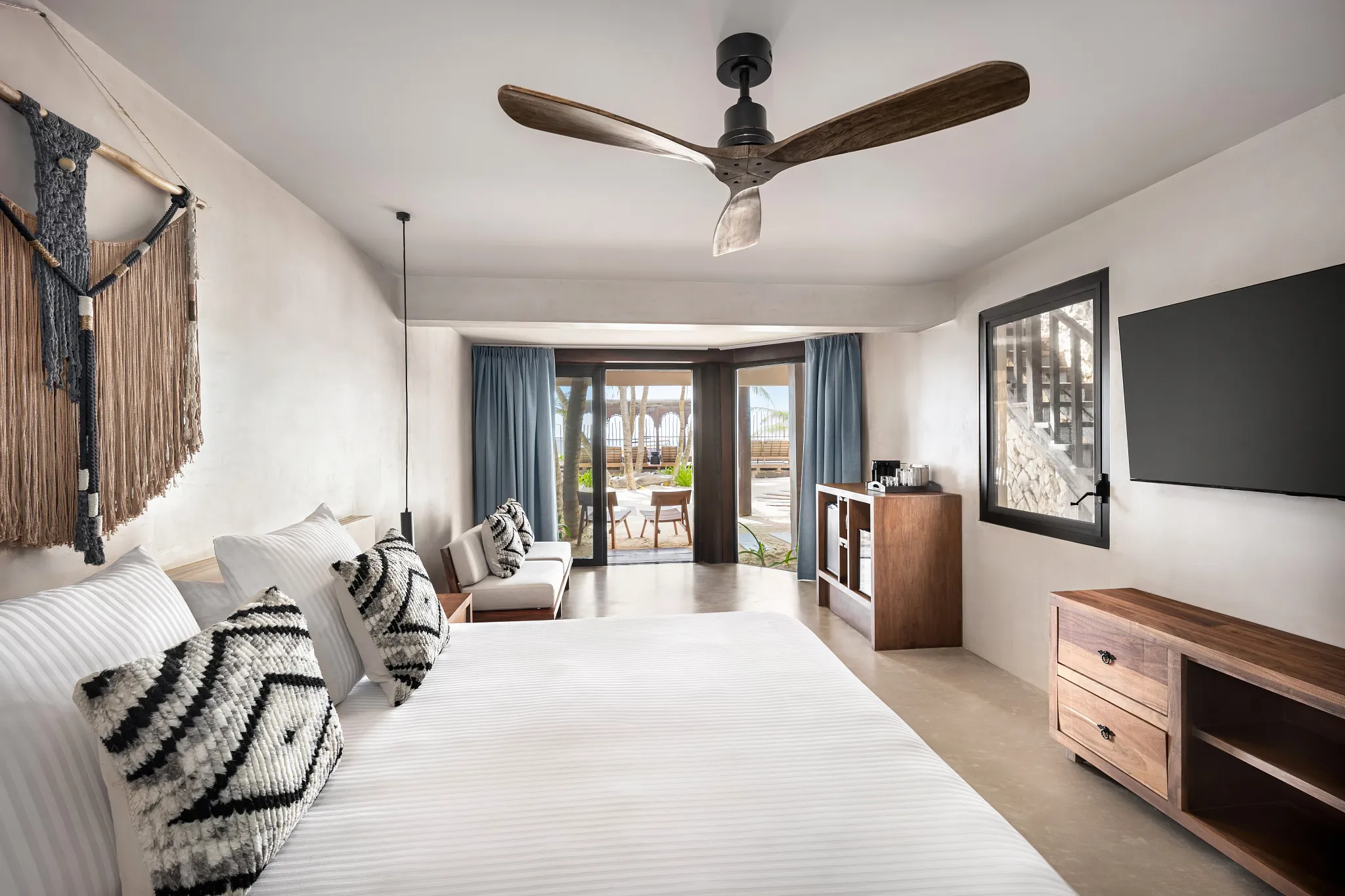 Casa Zamna Ocean Front king bedroom with sitting area at Secrets Tulum Resort & Beach Club.