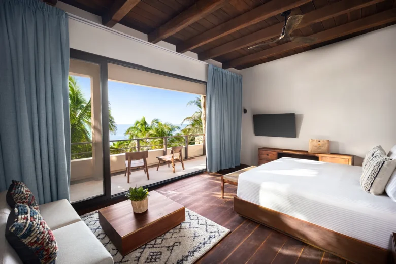 Casa Zamna Ocean Front Master Suite bedroom with king bed and private ocean-view terrace at Secrets Tulum Resort & Beach Club.