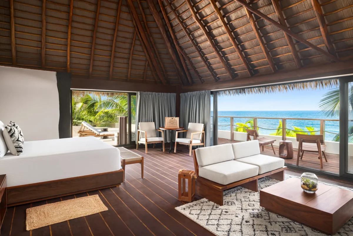 Casa Zamna Ocean Front Presidential Suite at Secrets Tulum Resort & Beach Club with king bed, living area, and panoramic Caribbean Ocean views.