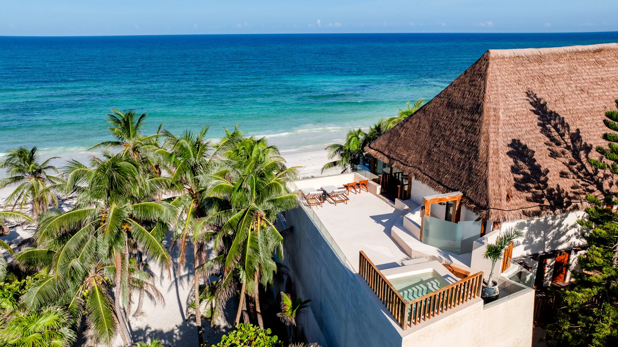 Rooftop terrace with plunge pool overlooking the Caribbean Sea at Casa Zamna Beach Club.