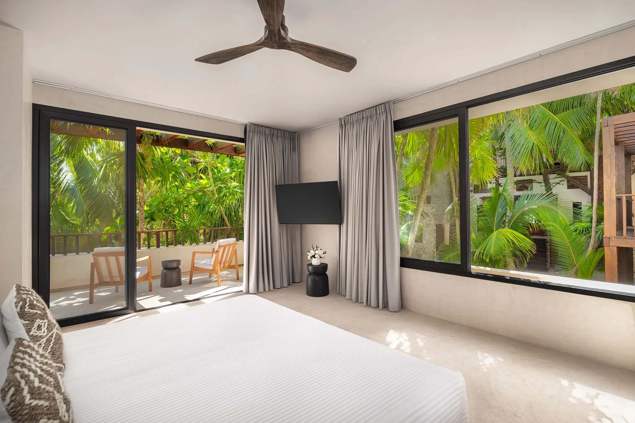 Casa Zamna Tropical View king bedroom with furnished terrace at Secrets Tulum Resort & Beach Club.