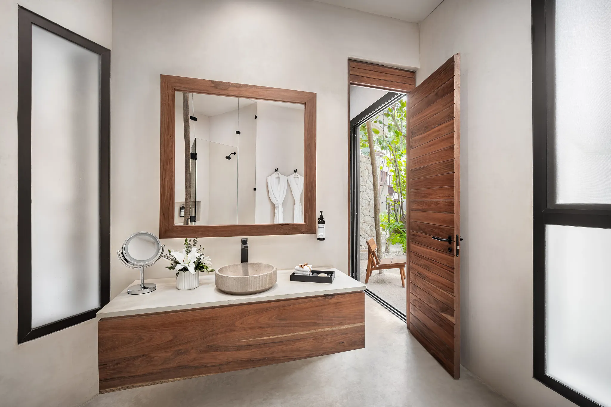 Casa Zamna Tropical View luxury bathroom with stone vessel sink at Secrets Tulum Resort & Beach Club.
