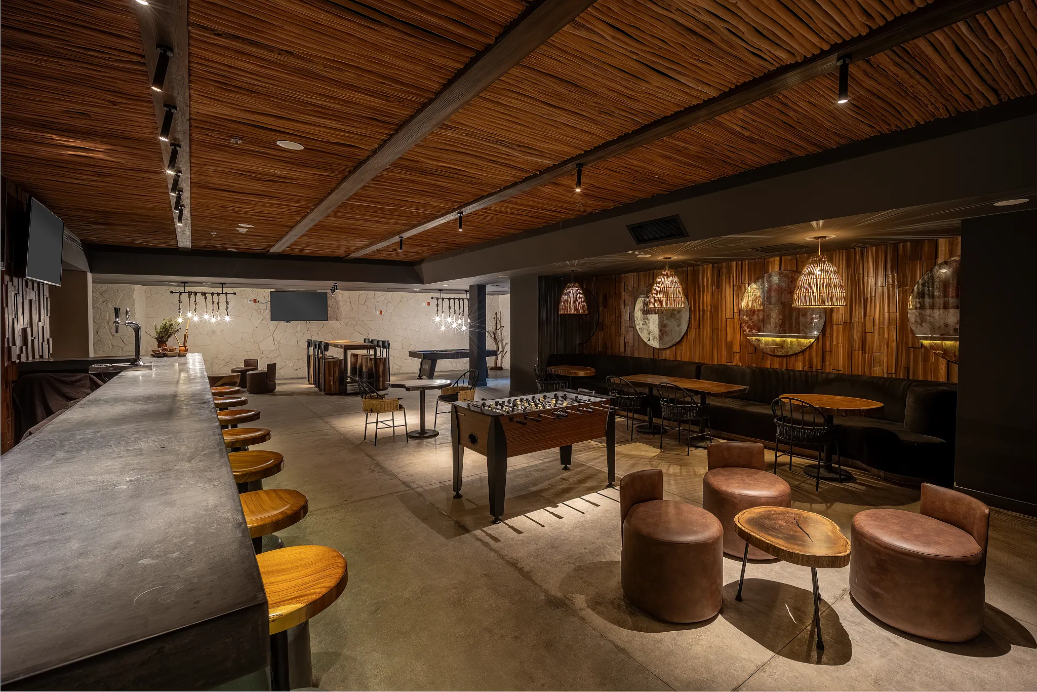 Half Time Sports Bar at Secrets Tulum Resort & Beach Club featuring big-screen TVs, premium drinks, casual seating, and a lively game-day atmosphere.