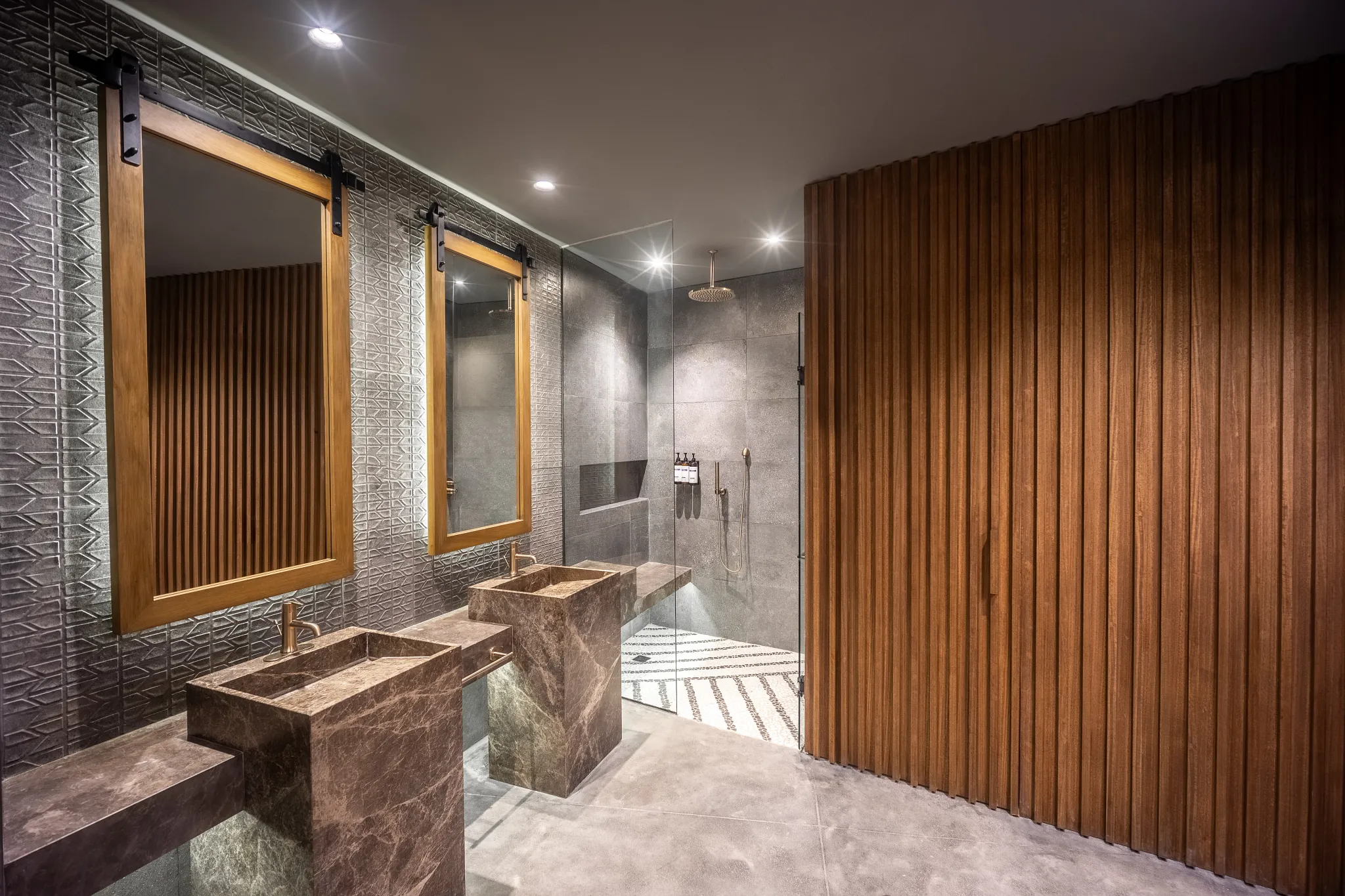 Junior Suite Swim Out bathroom with double stone sinks and separate rain shower at Secrets Tulum Resort & Beach Club.
