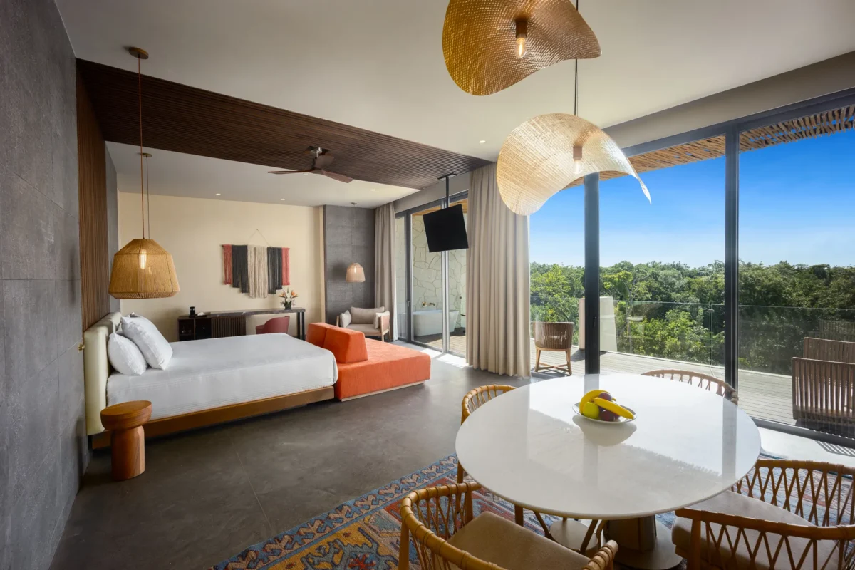 Preferred Club Master Suite Tropical View with king bed, dining area, and spacious living space at Secrets Tulum Resort & Beach Club.