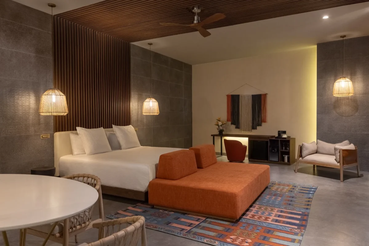 Preferred Club Rooftop Master Suite with king bed, spacious living area, and modern décor at Secrets Tulum Resort & Beach Club.