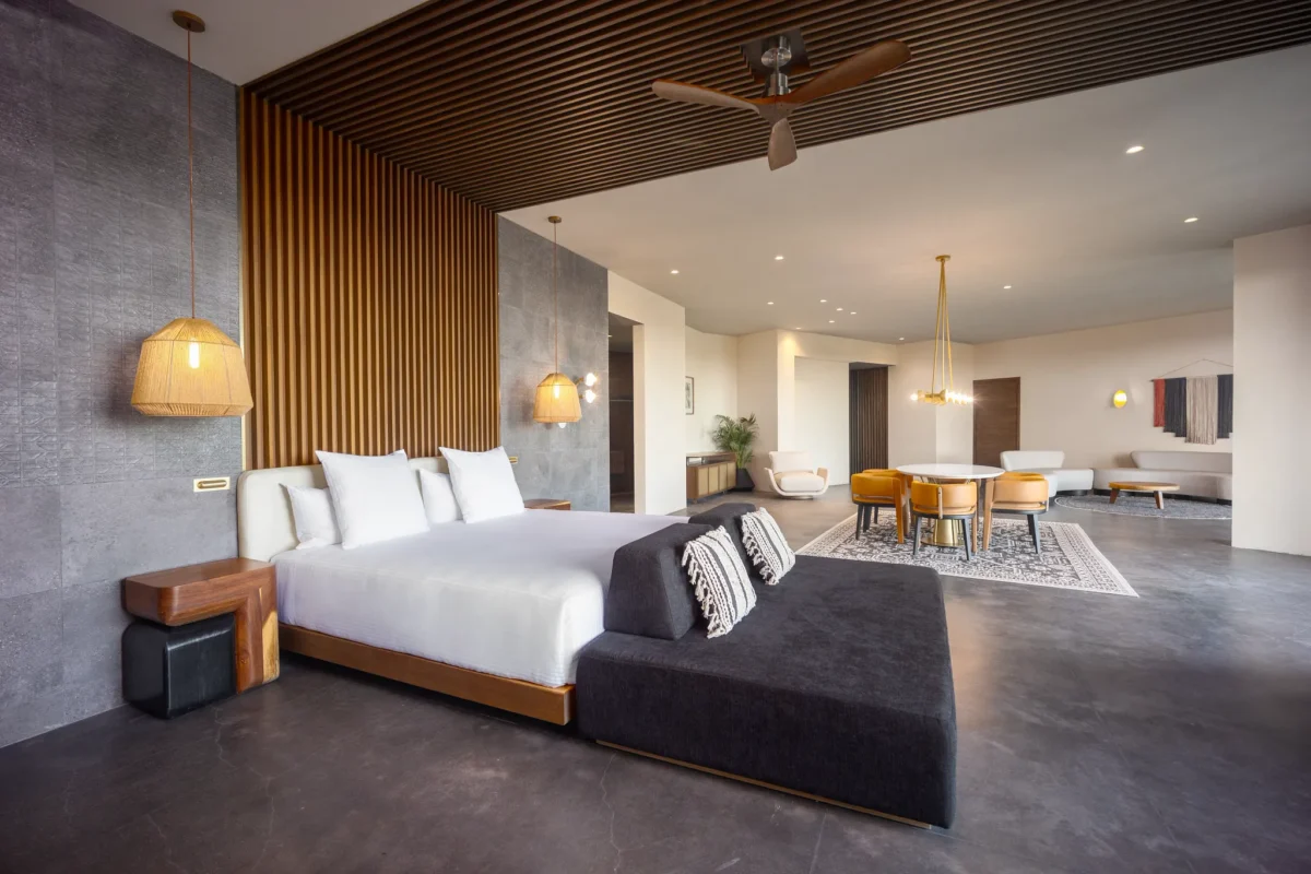 Presidential Suite bedroom with king bed, spacious living area, and contemporary décor at Secrets Tulum Resort & Beach Club.