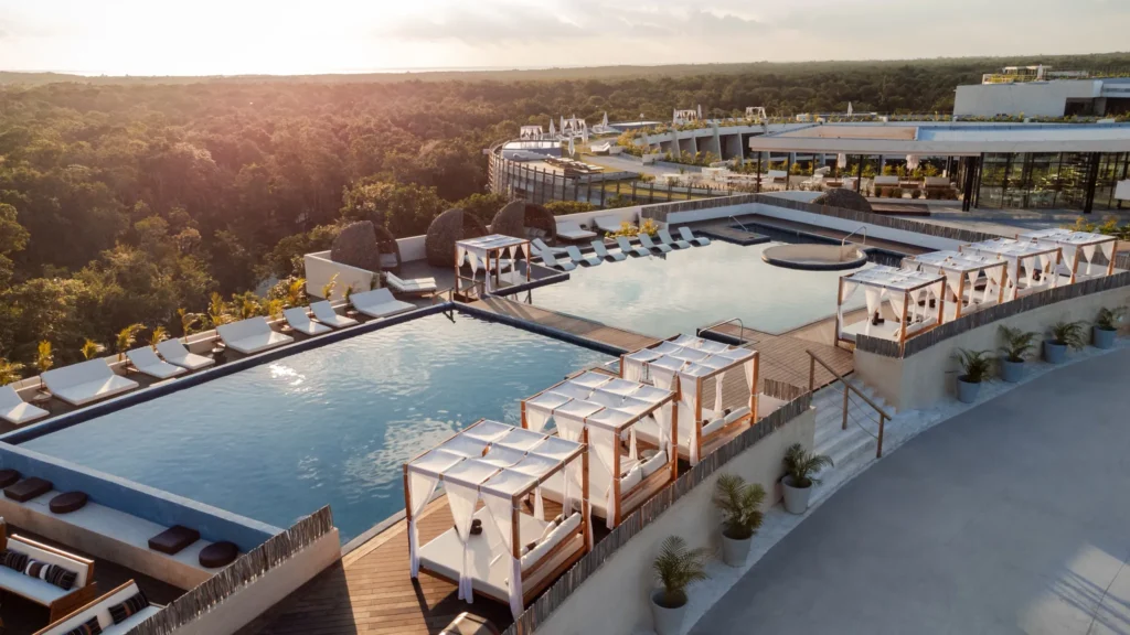 Rooftop pools with luxury cabanas overlooking the jungle at Secrets Tulum Resort & Beach Club.