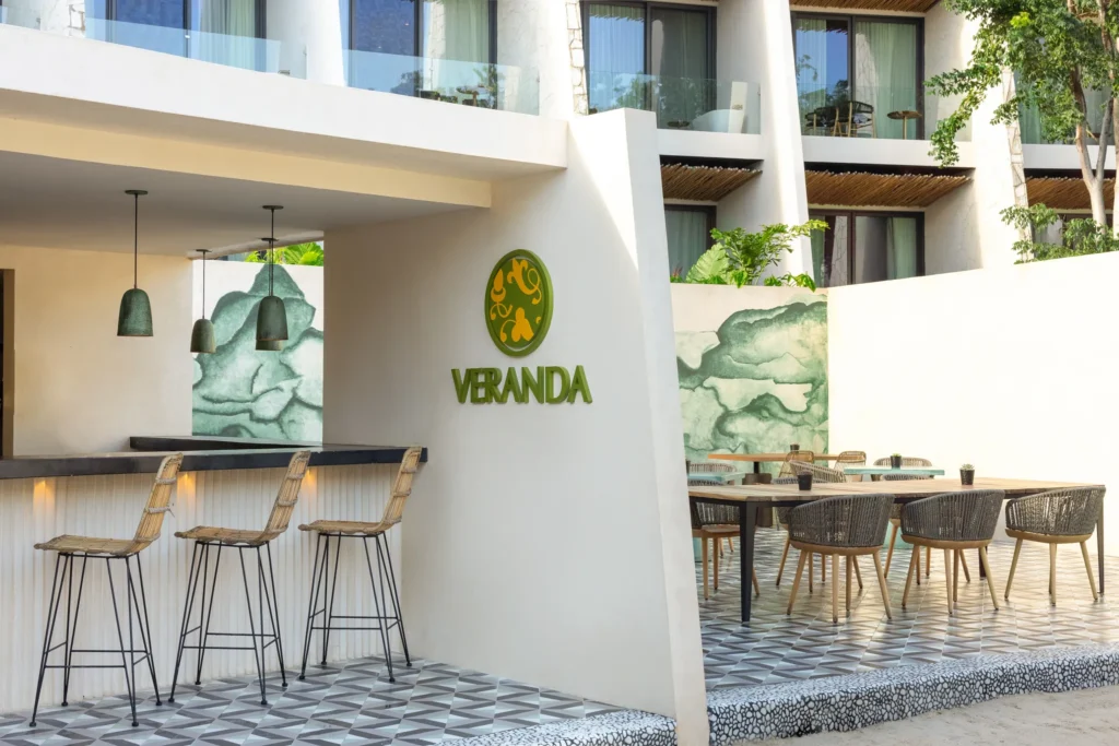 Veranda Lobby Bar at Secrets Tulum Resort & Beach Club featuring elegant lounge seating, handcrafted cocktails, and a sophisticated open-air ambiance.