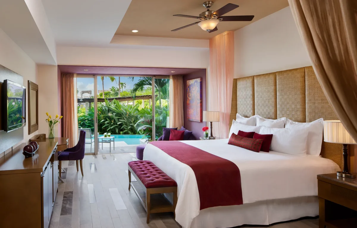 Junior Suite Swim Out with king bed and private terrace leading to pool at Secrets Vallarta Bay Puerto Vallarta.
