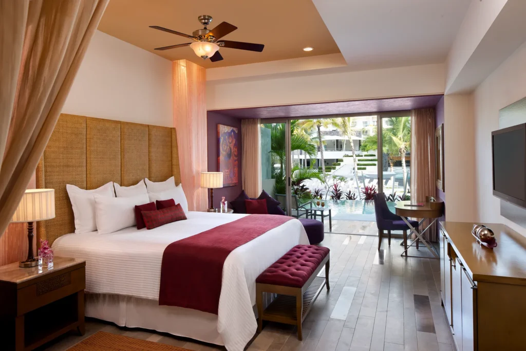 Preferred Club Junior Suite Swim Out with king bed and private terrace with direct pool access at Secrets Vallarta Bay Puerto Vallarta.