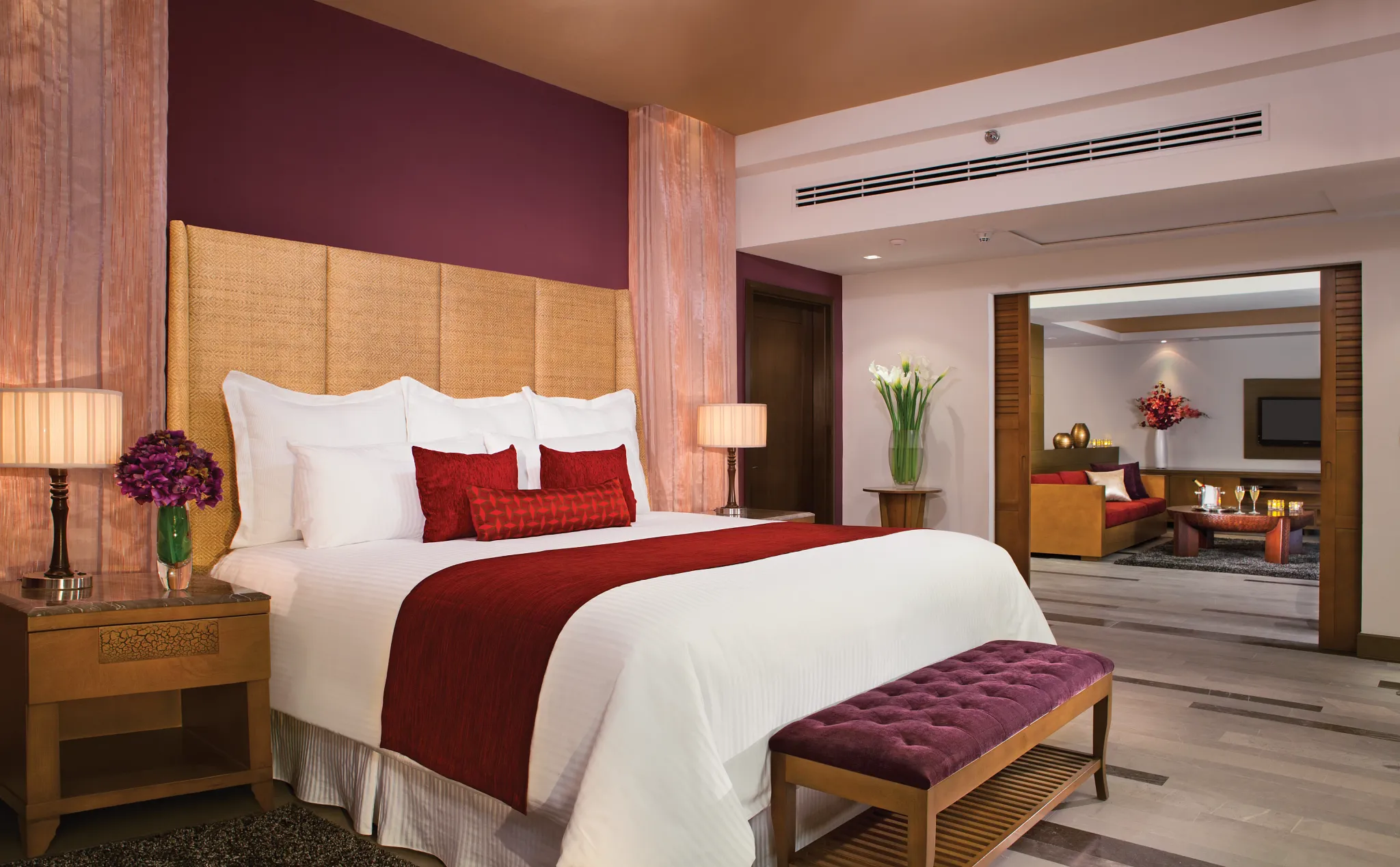 Presidential Suite master bedroom with king bed and adjoining living area at Secrets Vallarta Bay Puerto Vallarta.