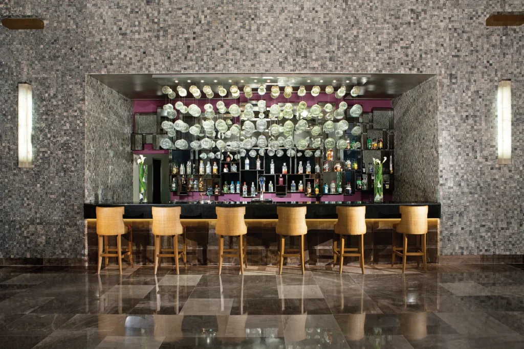 Rendezvous lobby bar at Secrets Vallarta Bay Puerto Vallarta featuring elegant lounge seating, handcrafted cocktails, and sunset views.