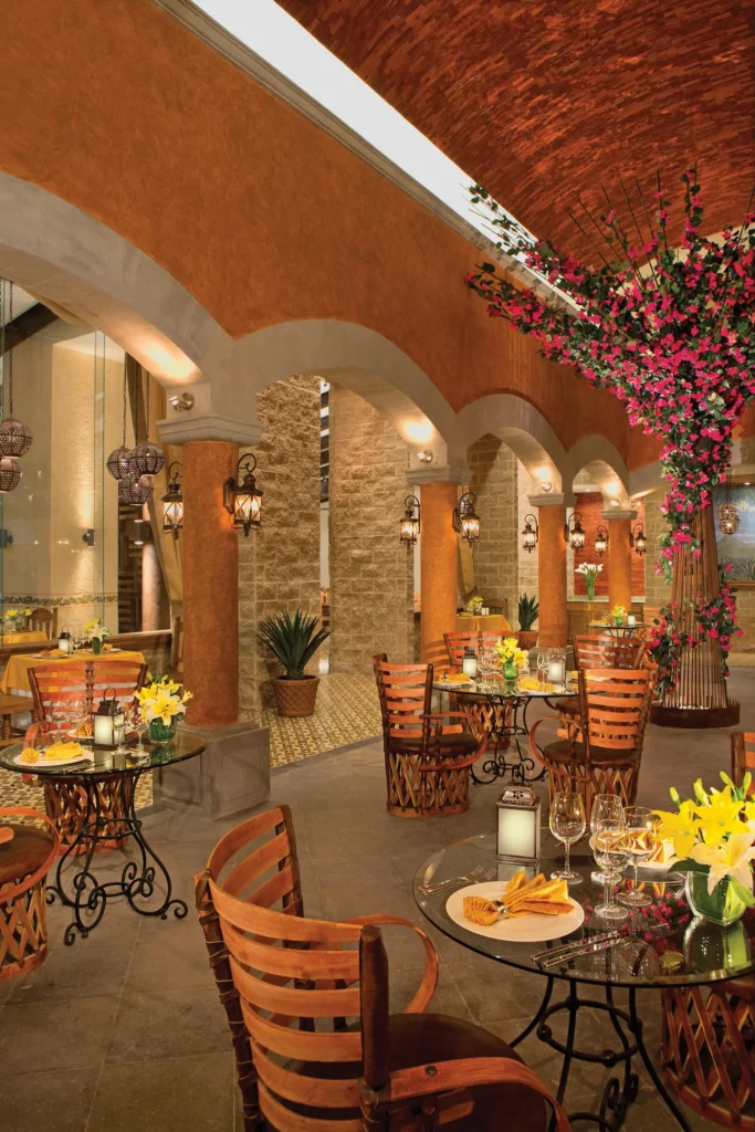 Tamarindo Mexican restaurant at Secrets Vallarta Bay Puerto Vallarta featuring authentic Mexican cuisine in an elegant, warmly lit dining atmosphere.