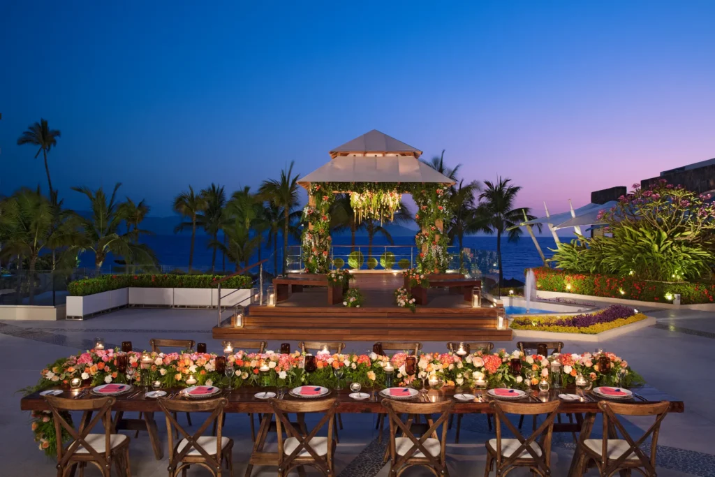 Evening reception setup with gazebo and long table at Vista Terrace at Secrets Vallarta Bay Puerto Vallarta