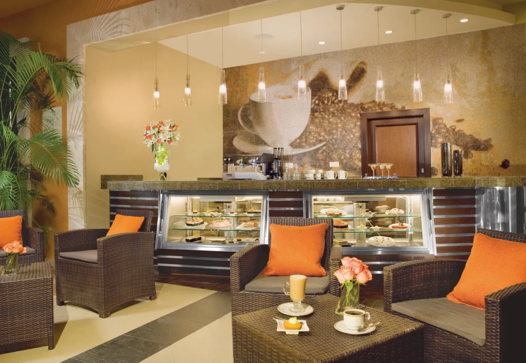Coco Café at Secrets Wild Orchid Montego Bay featuring premium coffee, fresh pastries, and a cozy lounge-style seating area.