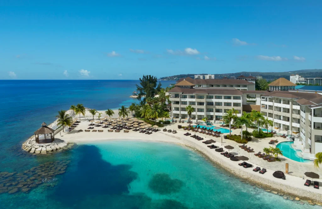 Aerial view of Preferred Club section at Secrets Wild Orchid Montego Bay with private beach and pools.