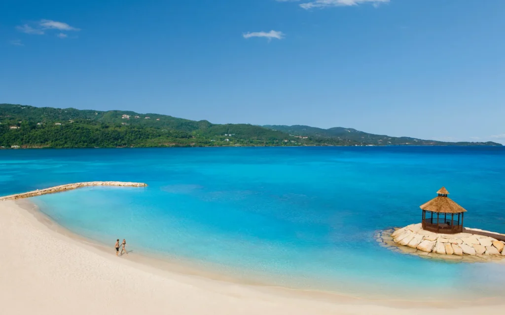 Preferred Club private beach with gazebo and turquoise water at Secrets Wild Orchid Montego Bay.