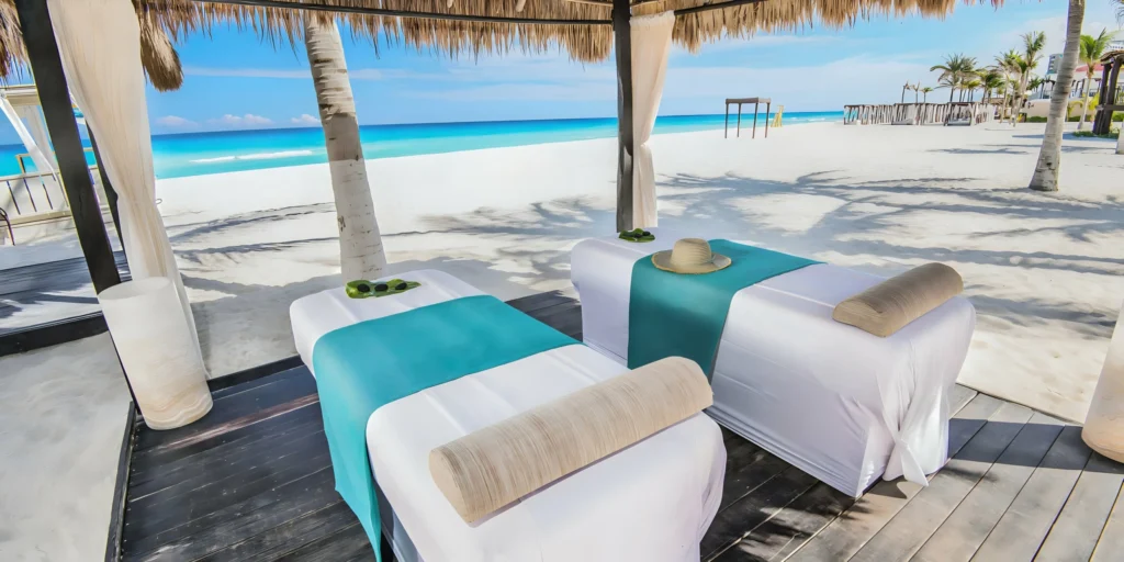 Outdoor beachfront massage cabana at Sunscape Cancun Resort & Spa overlooking the Caribbean Sea.