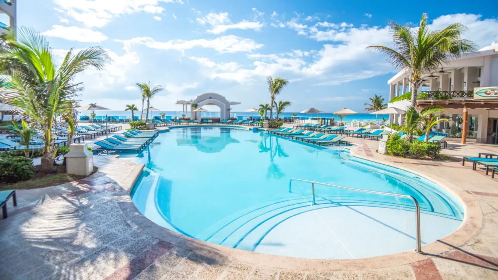 Main infinity-style pool at Sunscape Cancun Resort & Spa overlooking the Caribbean Sea in Cancun.