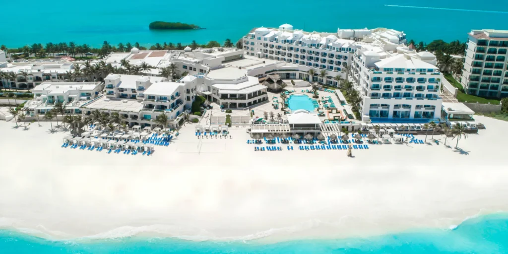 Panoramic aerial view of Sunscape Cancun Resort & Spa along Cancun’s white-sand Caribbean coastline.
