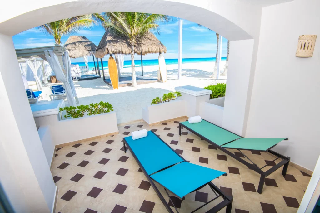 Private beachfront terrace with loungers at Sunscape Cancun Resort & Spa.