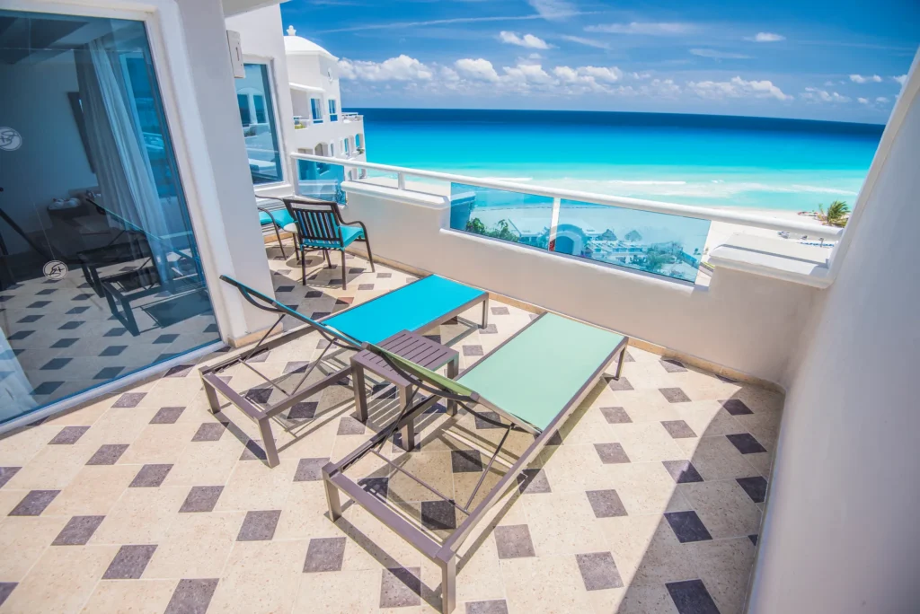Master Suite Ocean View private terrace with lounge chairs at Sunscape Cancun Resort & Spa.
