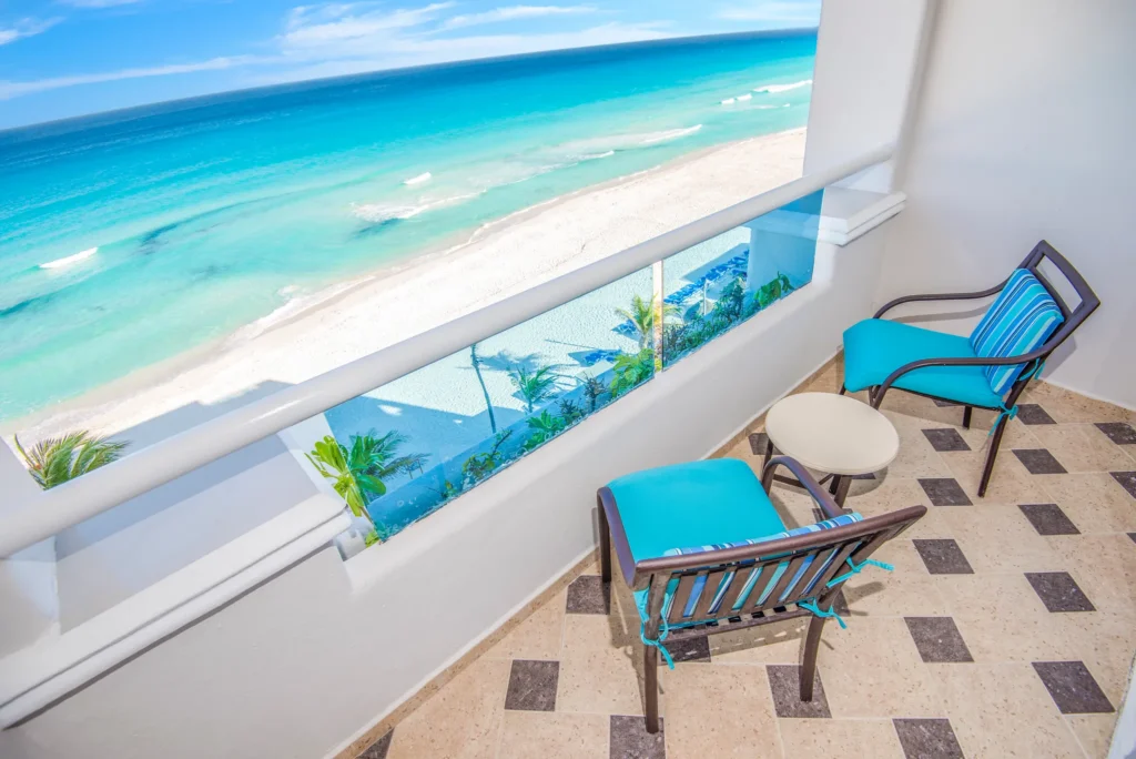 Oceanfront Junior Suite balcony with panoramic Caribbean Sea views at Sunscape Cancun Resort & Spa.